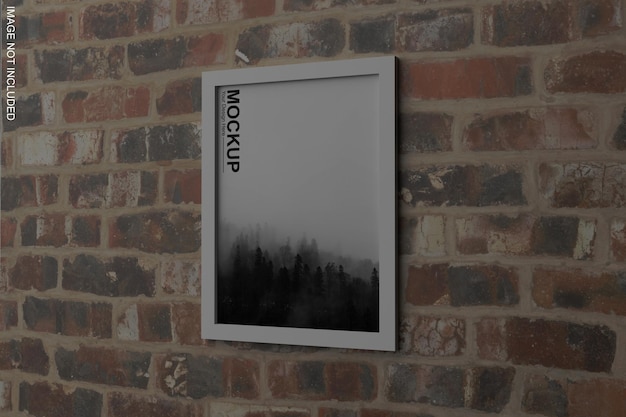 A framed poster on a brick wall says'mockup '