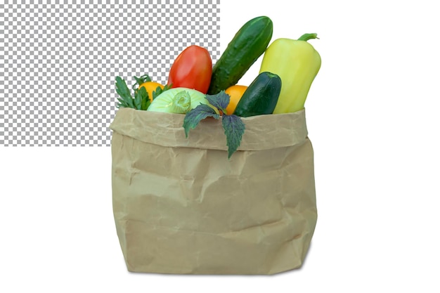 Fresh various vegetables lie in a kraft bag isolated on a transparent background