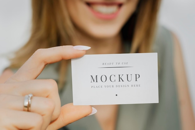 Friendly woman carrying a business card mockup