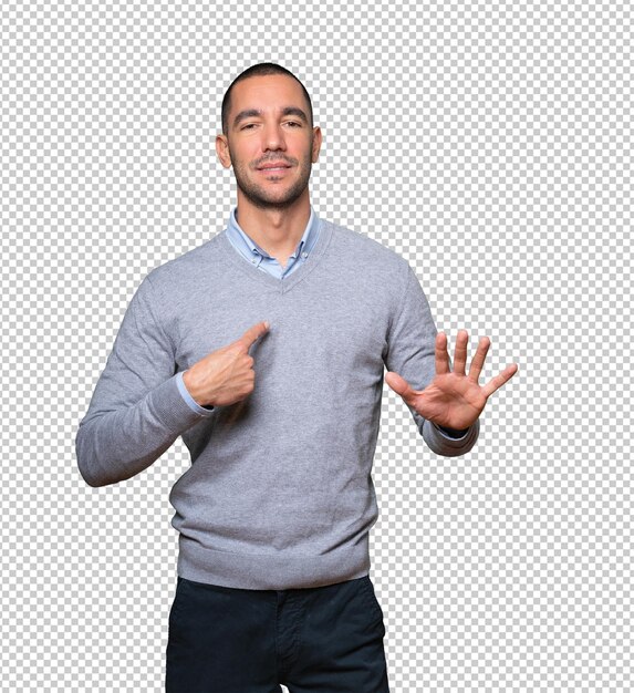 Friendly young man doing a gesture of keep calm