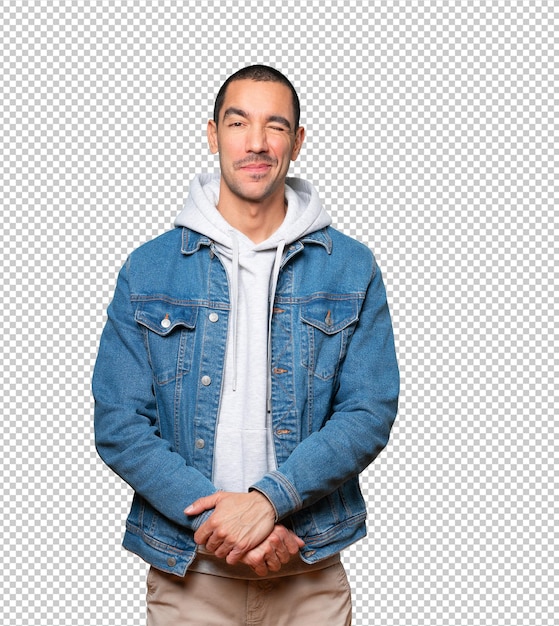 friendly young man winking an eye