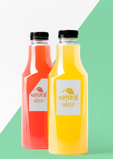 front view of assortment of clear juice bottles