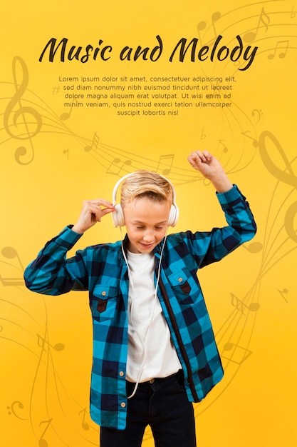 Front view of boy dancing while listening to music on headphones