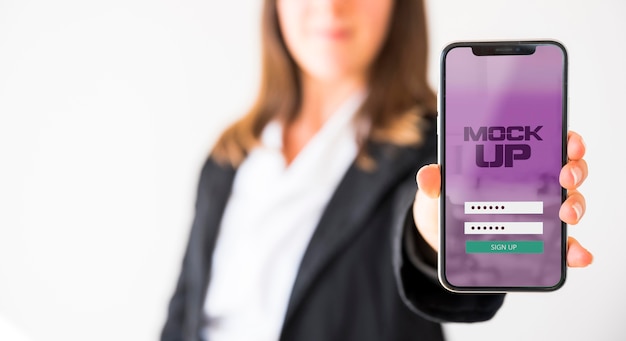 front view of businesswoman holding smartphone