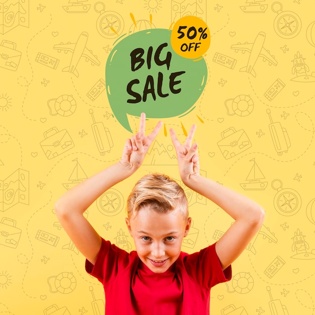 PSD front view of child making peace signs with big sale