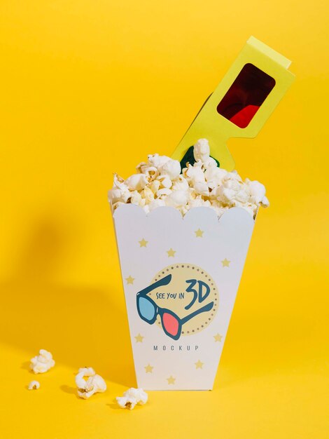 Front view of cinema popcorn with glasses