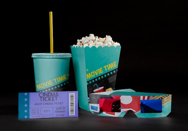 front view of cinema popcorn with ticket and threedimensional glasses