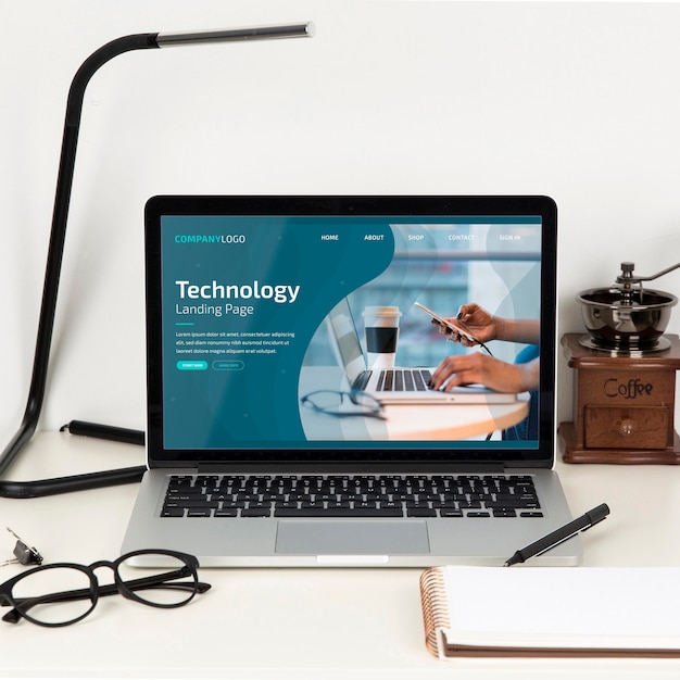 Front view of desk surface with lamp and glasses