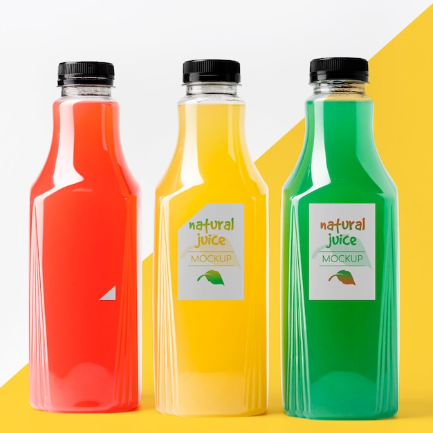 front view of different glass juice bottles