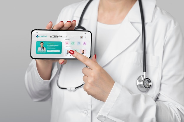 Front view doctor pointing at smartphone