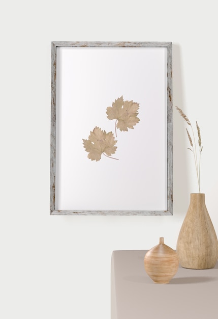 PSD front view of frame with leaves on wall and vases