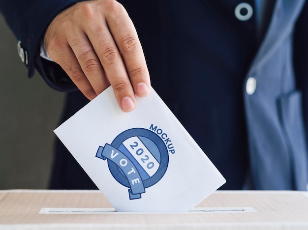 PSD front view man putting ballot mock-up in box