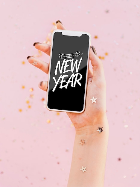 Front view new year minimalist lettering on phone