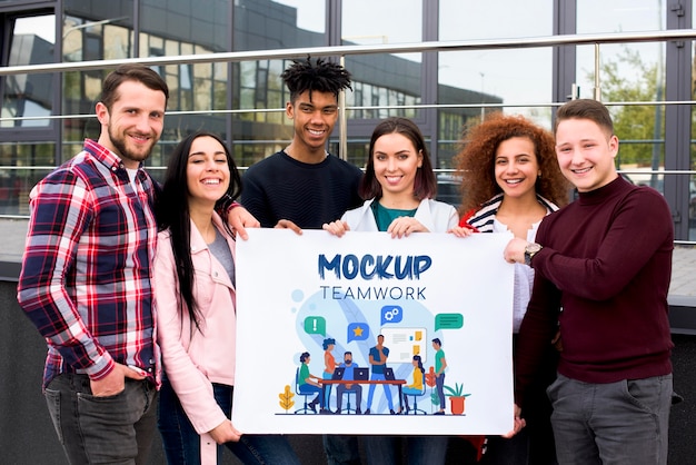front view people holding teamwork mock-up