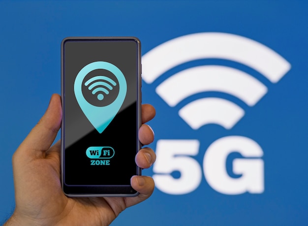 Front view person holding a phone with wi-fi 5g network