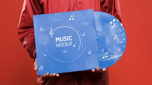 PSD front view of person holding an vinyl mock-up