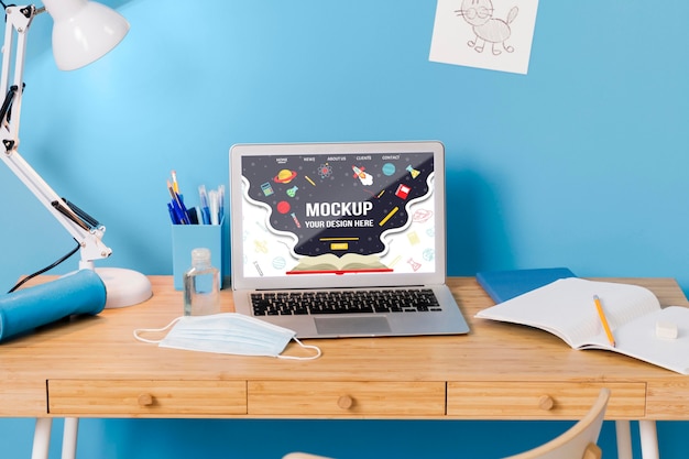 PSD front view of school desk with laptop and lamp