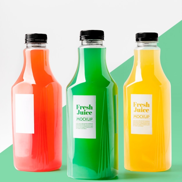 front view of selection of transparent juice bottles