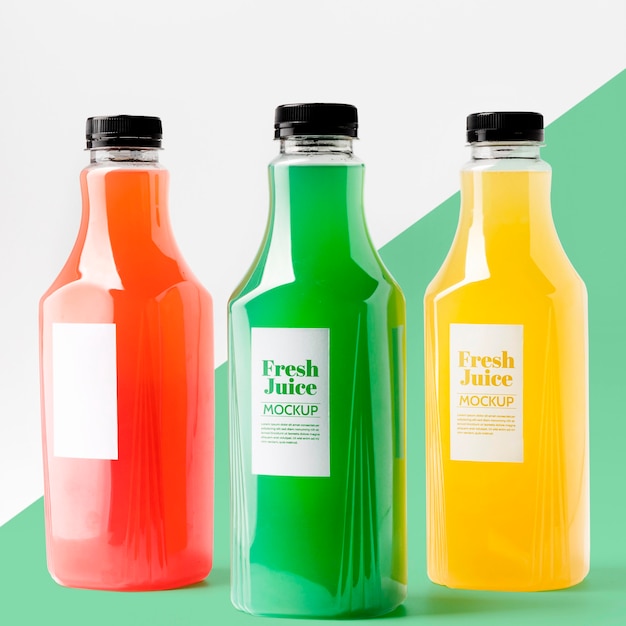 Front view of selection of transparent juice bottles