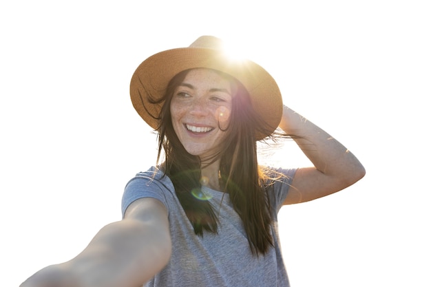 Front view smiley woman wearing hat