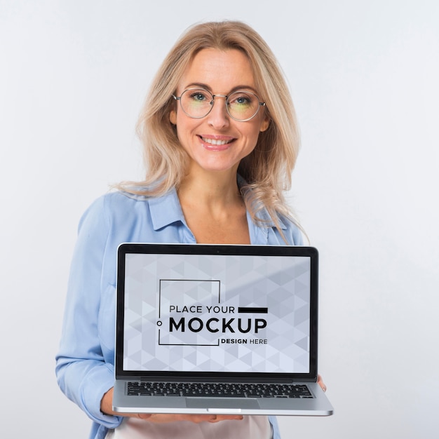 PSD front view of smiley woman with glasses holding laptop