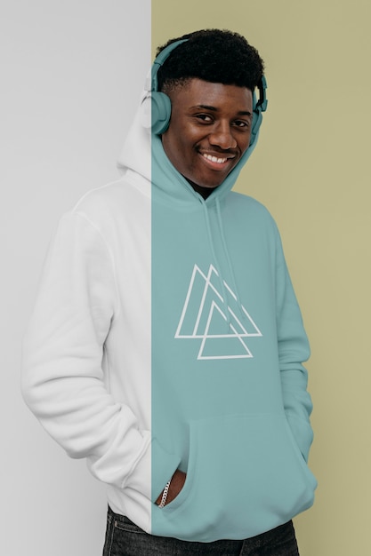 front view of stylish man in hoodie with headphones