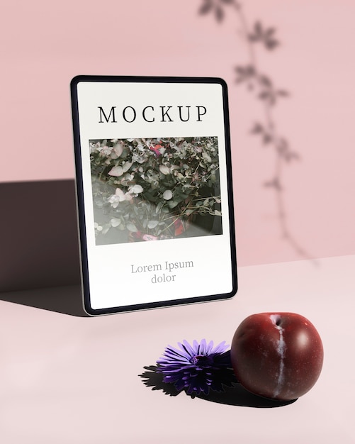 front view of tablet with plum and flower