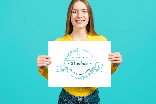 PSD front view of woman holding a stationery mock-up card