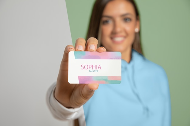 PSD front view of woman showing business card