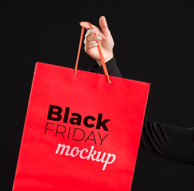 Front view of woman with black friday concept