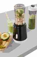 PSD fruit juicer and blender wih juice in glass and bottle