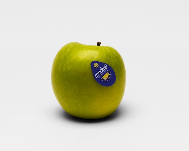 PSD fruit sticker mock-up on apple fruit