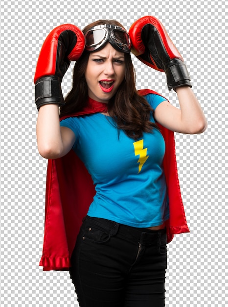 Frustrated pretty superhero girl  with boxing gloves