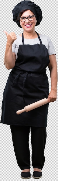 PSD full body middle aged baker woman cheerful and excited, smiling and raising her thumb up, concept of success and approval, ok gesture