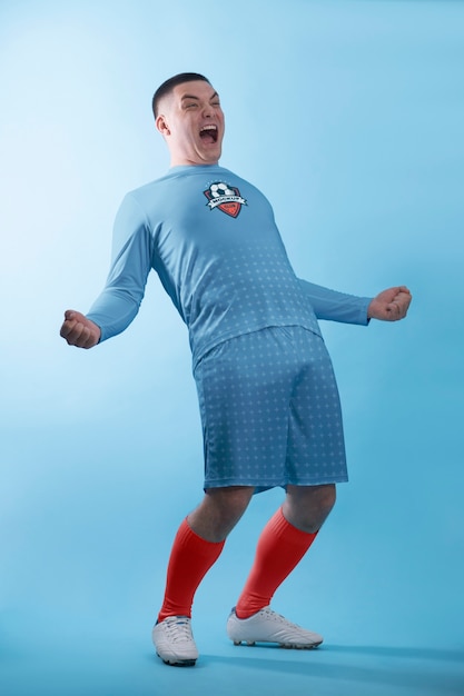 PSD full shot excited man wearing soccer equipment