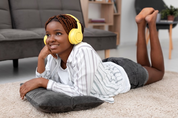 Full shot smiley woman with headphones