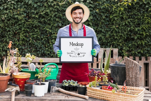 Gardener holding mock-up sign