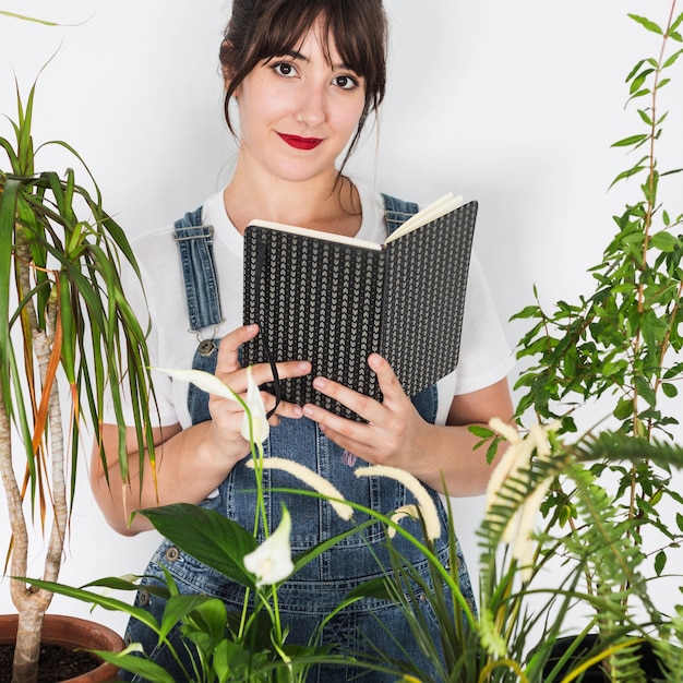 Gardening concept with woman reading book