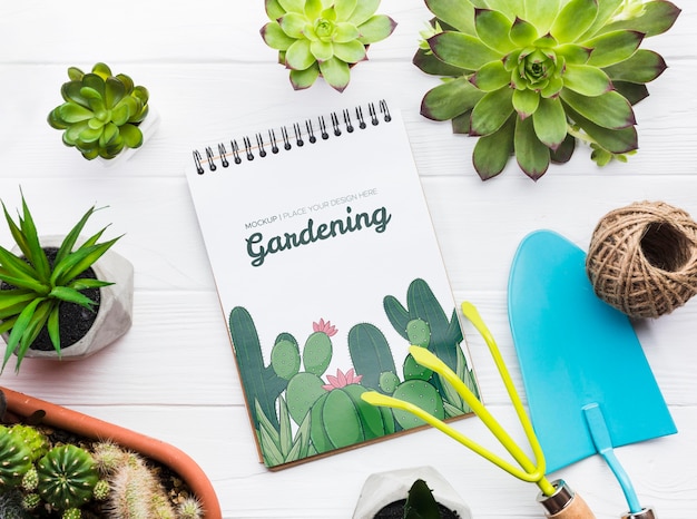 Gardening tools on wooden table flat lay