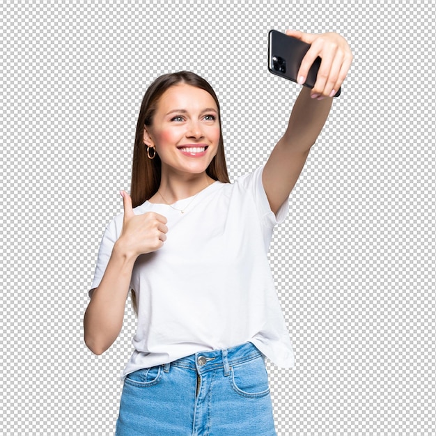 Gelukkig vrolijke jonge vrouw duim opdagen en selfie maken op smartphone geïsoleerd