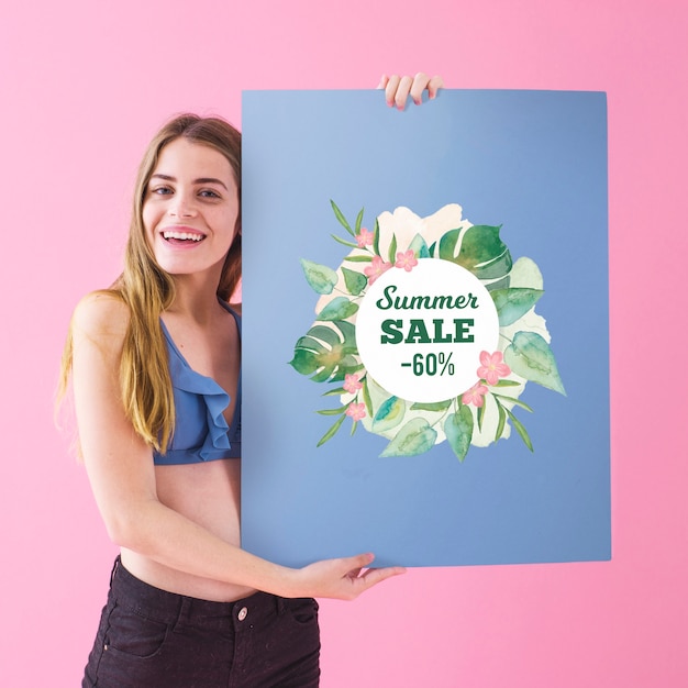 Girl showing summer sale poster