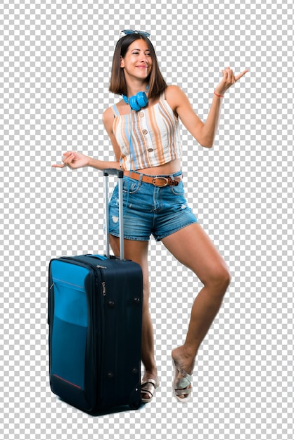 Girl traveling with her suitcase enjoy dancing while listening to music at a party