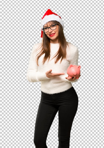 PSD girl with celebrating the christmas holidays holding a big piggybank