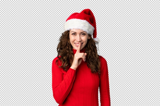 Ragazza con il cappello di natale che fa gesto di silenzio