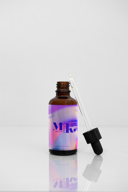 PSD glass bottle with liquid inside mockup