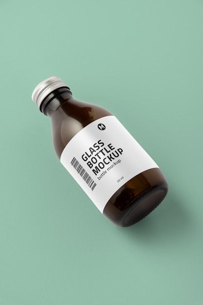 glass bottle with tag mockup