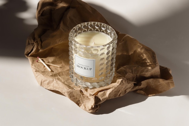 Glass candle label mockup with matches and craft paper