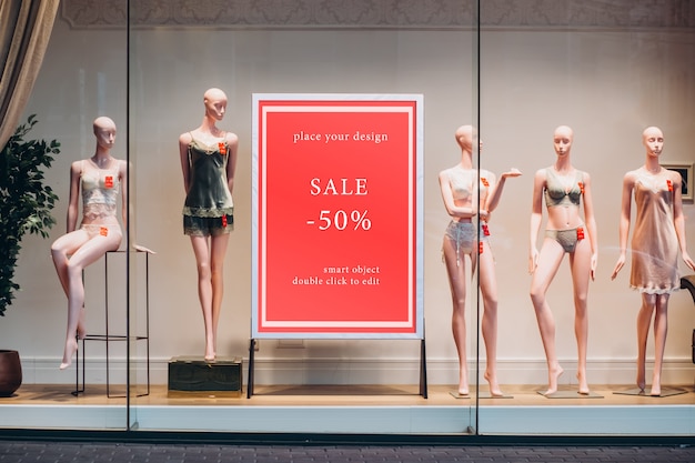 Glass shop window with mannequins, mockup