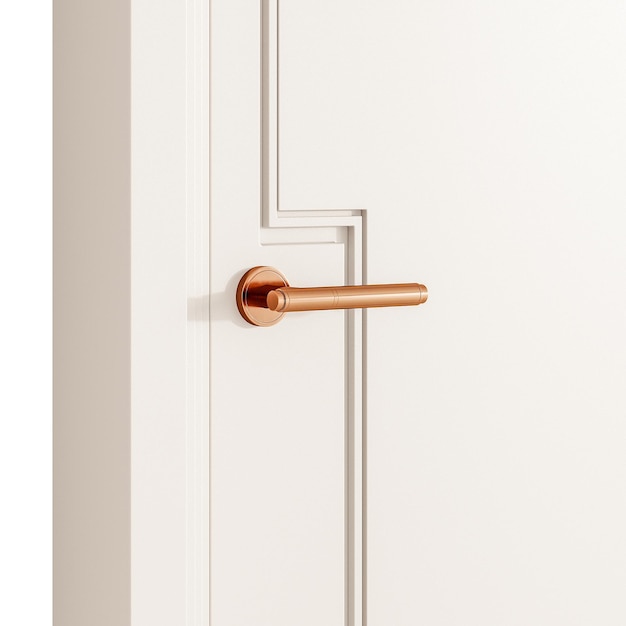 A gold colored door handle sits on a white door