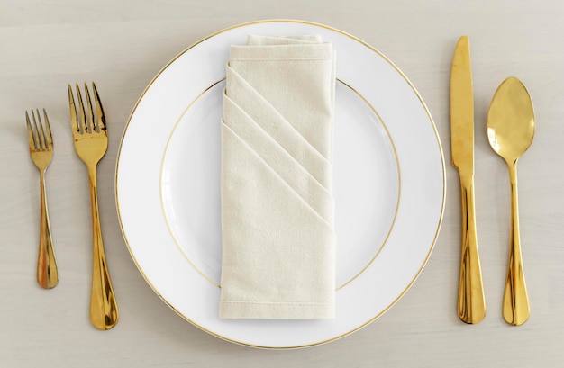 PSD gold cutlery table setting flatlay